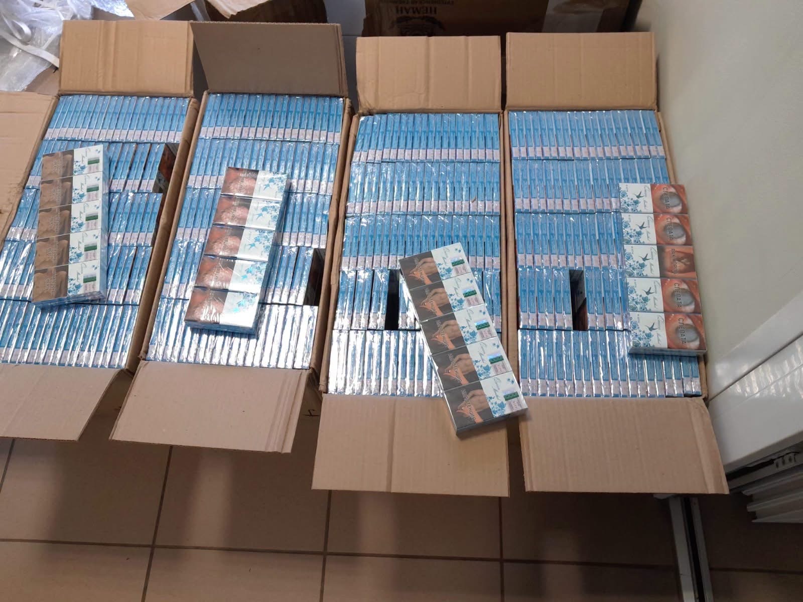 Seized cigarette packs organized in cardboard boxes at Druskininkai outpost
